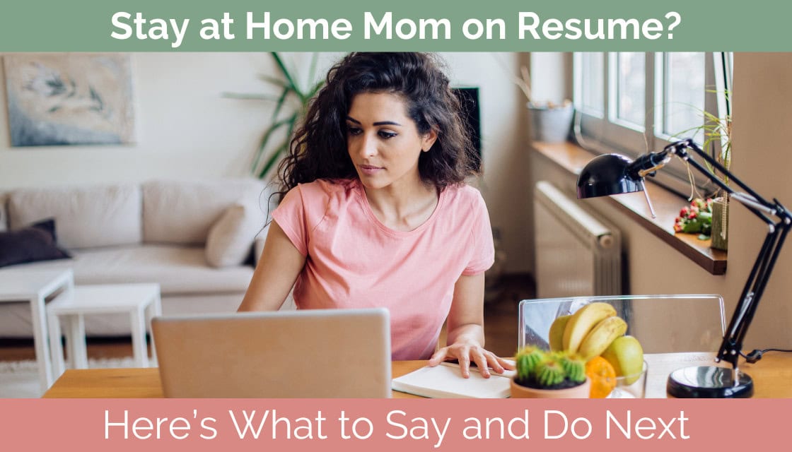 Mom sitting at a kitchen table with a laptop, updating her resume and researching job opportunities online.